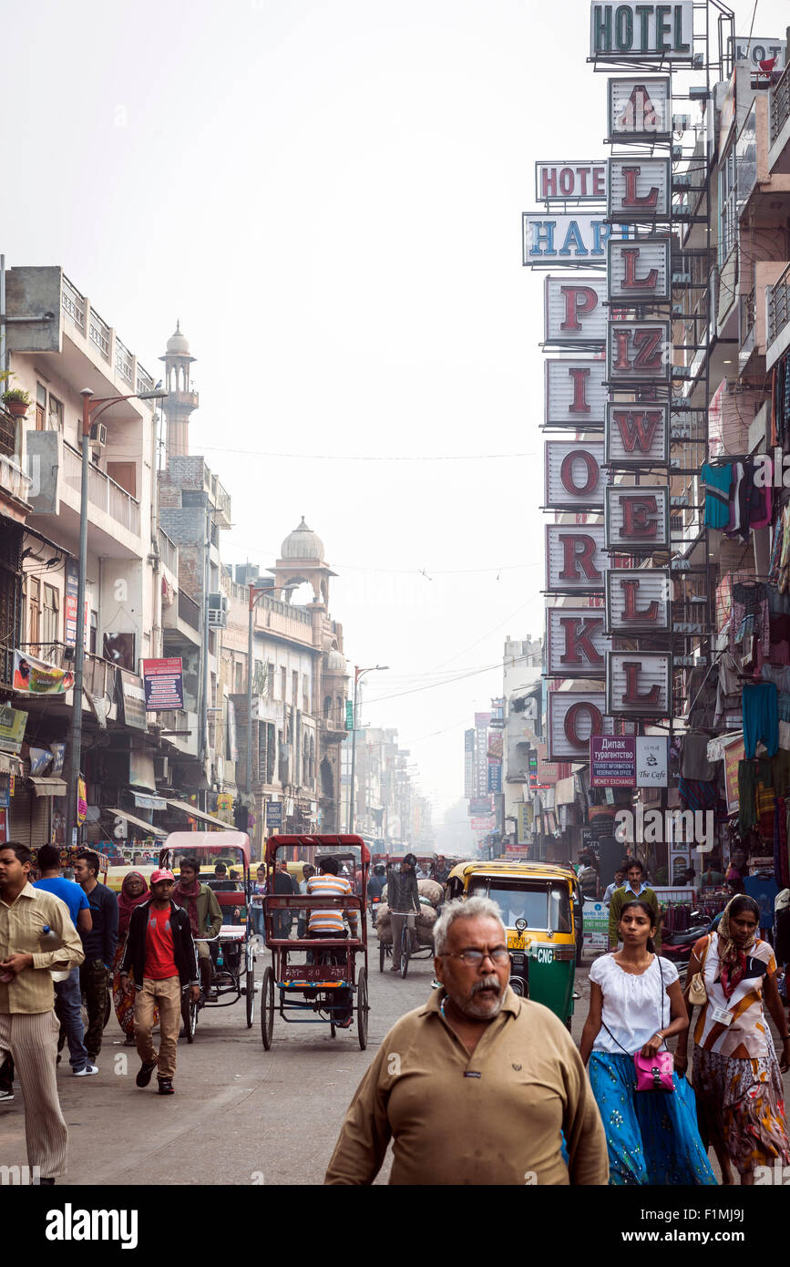 Tourists and locals mingle on busy Main Bazaar in the Paharganj District of New Delhi, India Stock Photo