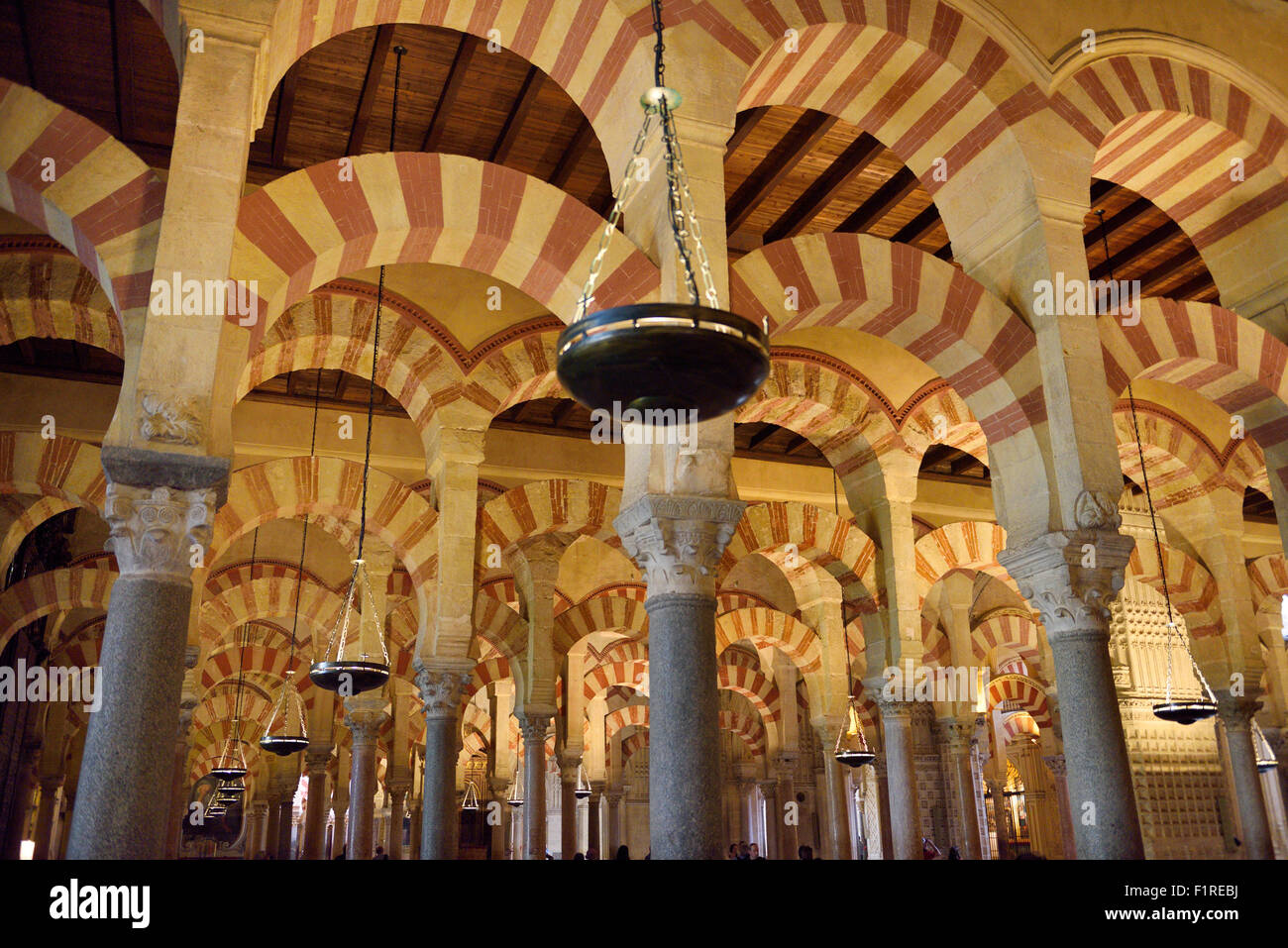 Double red and white arches on pillars at the Hypostyle Prayer Hall in the Cordoba Cathedral Mosque Stock Photo