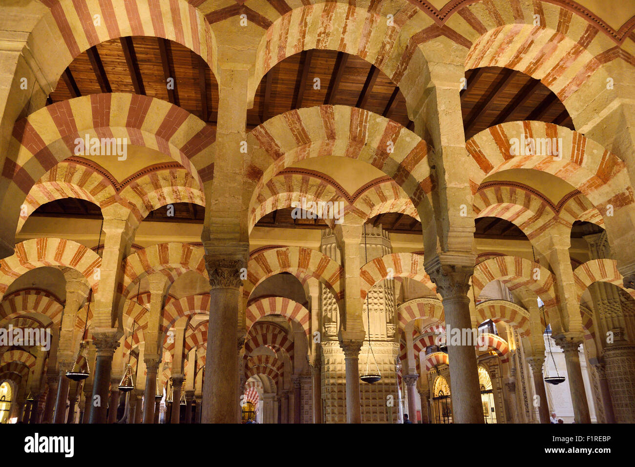 Double arches of white stone and red brick at the Hypostyle Prayer Hall in the Cordoba Cathedral Mosque Stock Photo