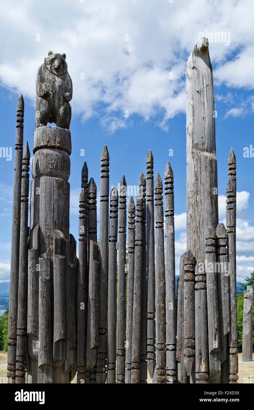 Native Japanese (Ainu) wooden totem poles with bear figure at Burnaby Mountain Park in Greater Vancouver, BC, Canada. Stock Photo