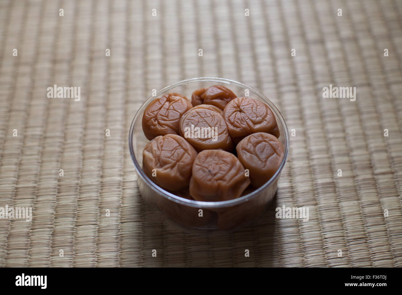 Umeboshi ume Japanese dried pickled salty plum centered from high angle Stock Photo