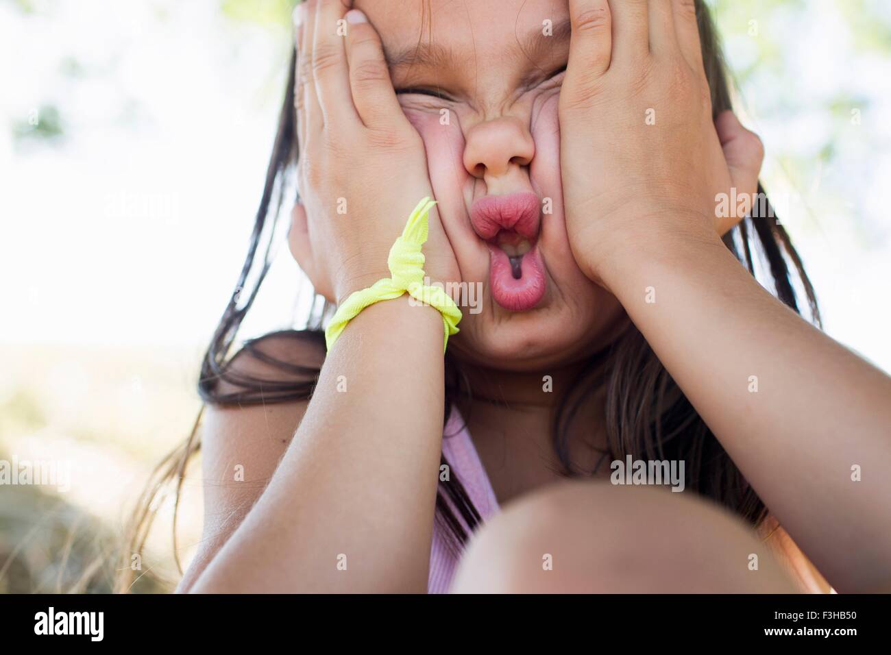 Portrait of girl squashing her face Stock Photo