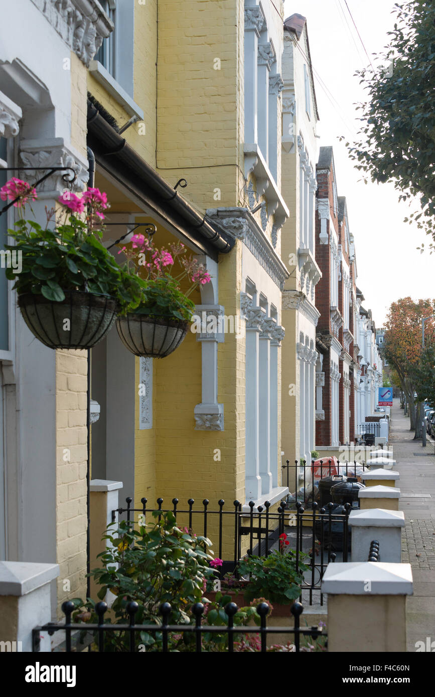 Row of terraced Victorian houses, Aliwal Road, Battersea, London Borough of Wandsworth, London, England, United Kingdom Stock Photo