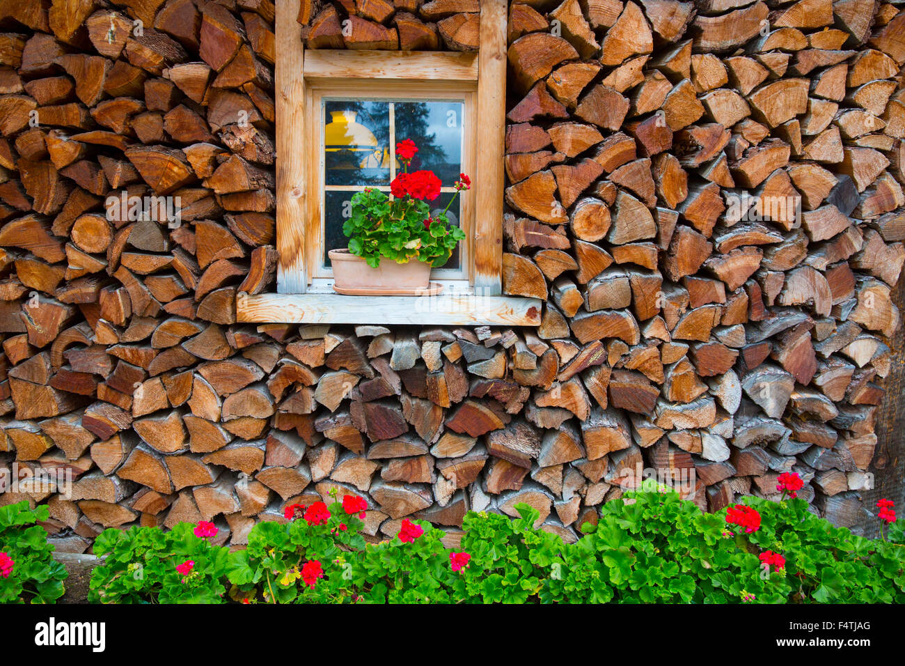 Window with floral decoration in Engadin, Stock Photo