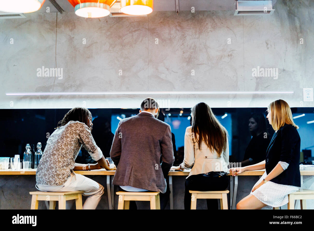 Business people having a break from work and conversing Stock Photo