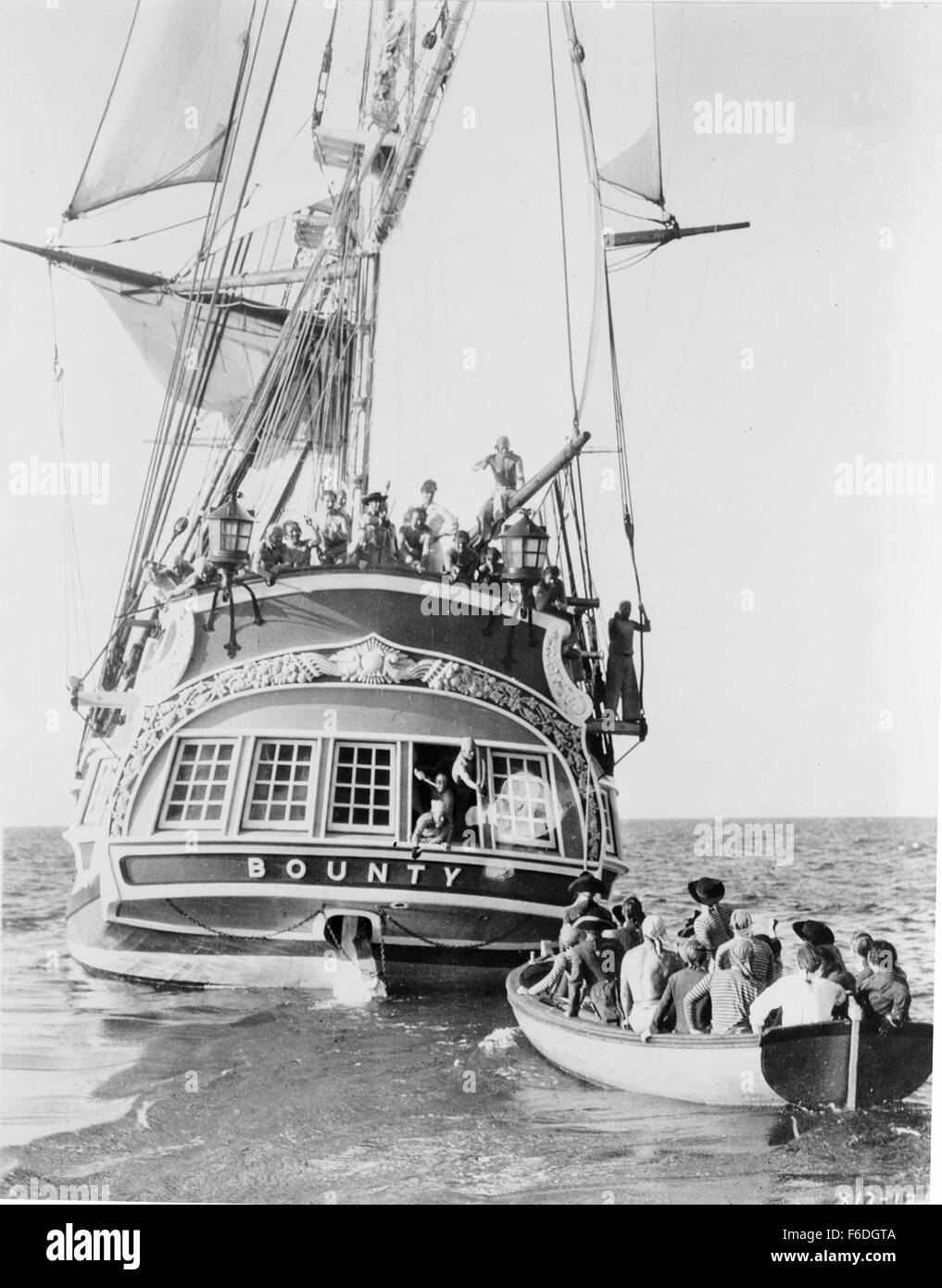 RELEASE DATE: November 22, 1935. MOVIE TITLE: Mutiny on the Bounty. STUDIO: Metro-Goldwyn-Mayer (MGM). PLOT: Midshipman Roger Byam joins Captain Bligh and Fletcher Christian aboard the HMS Bounty for a voyage to Tahiti. Bligh proves to be a brutal tyrant and, after six pleasant months on Tahiti, Christian leads the crew to mutiny on the homeward voyage. Even though Byam takes no part in the mutiny, he must defend himself against charges that he supported Christian. PICTURED: . Stock Photo