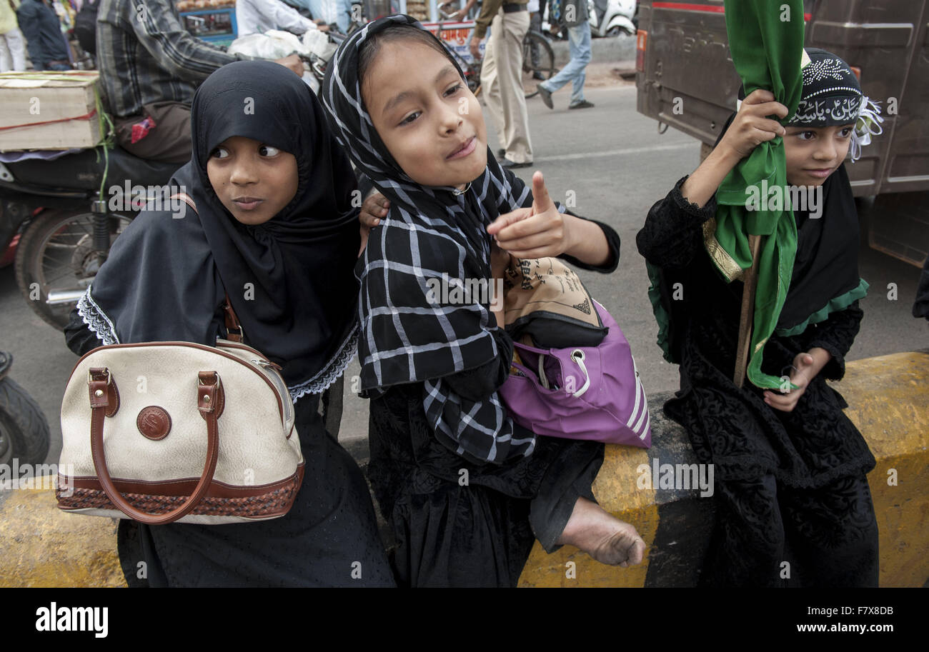 Raipur, India. 3rd Dec, 2015. Indian Shiite Muslims girls watch the Arba'een procession, a Shia Muslim religious observance that occurs forty days after the Day of Ashura. in Raipur, India, Dec. 3, 2015. The Arba'een procession commemorates the martyrdom of Husayn ibn Ali, the grandson of Prophet Muhammad, who was killed in the 17th century. Credit:  Tumpa Mondal/Xinhua/Alamy Live News Stock Photo