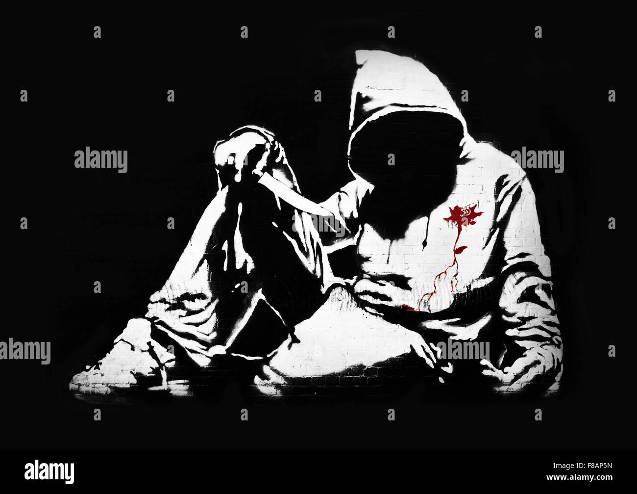 Banksy Hoodie with Knife Graffiti Stock Photo