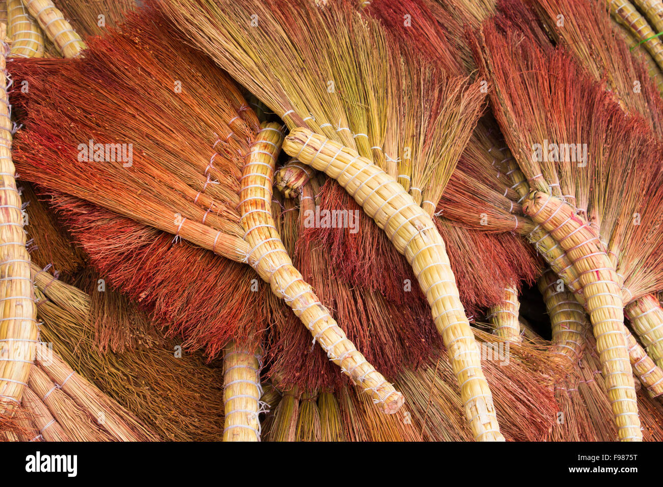 Pile of handmade brooms Stock Photo