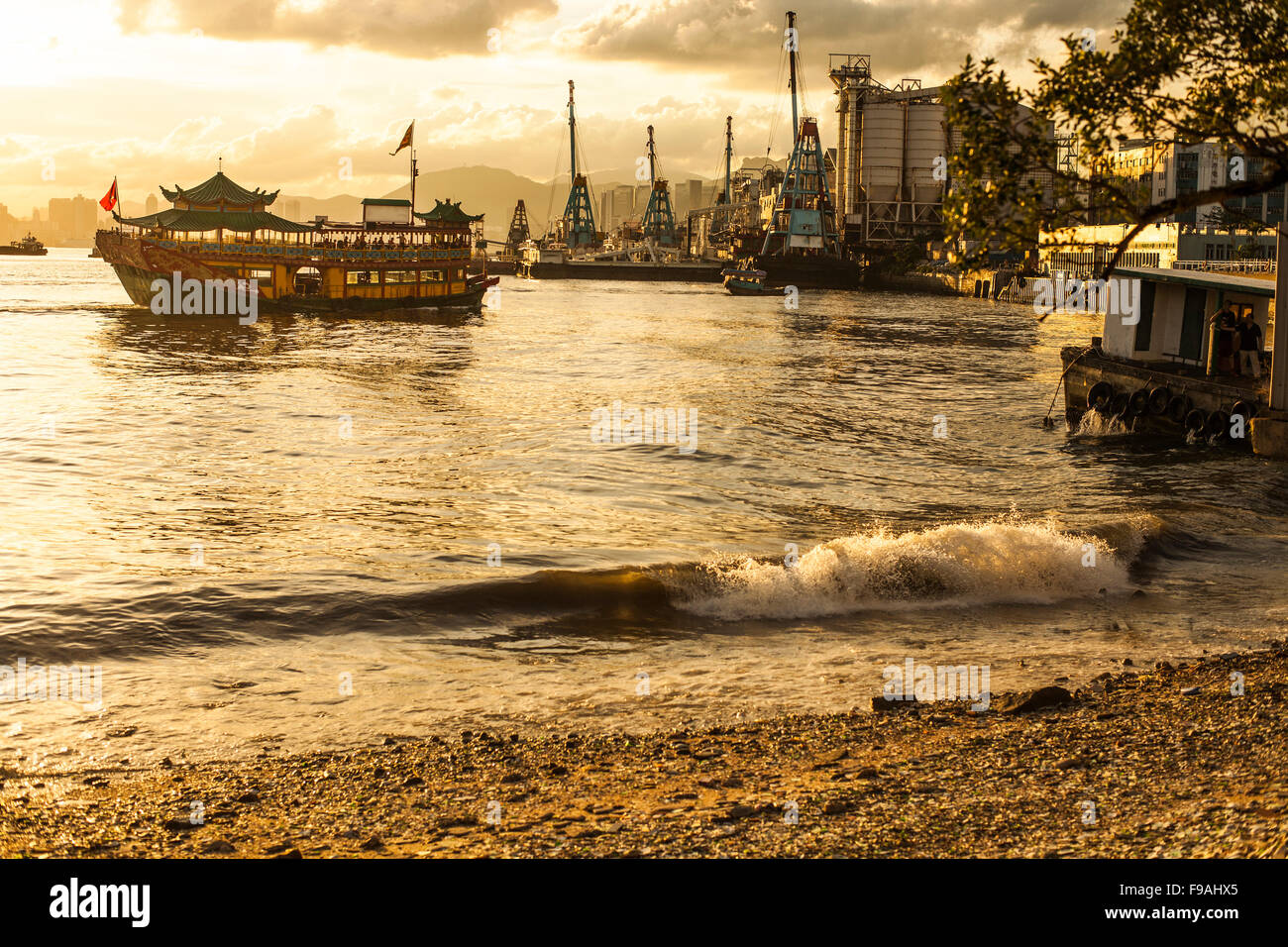 Chinese junk boat at sunset Stock Photo