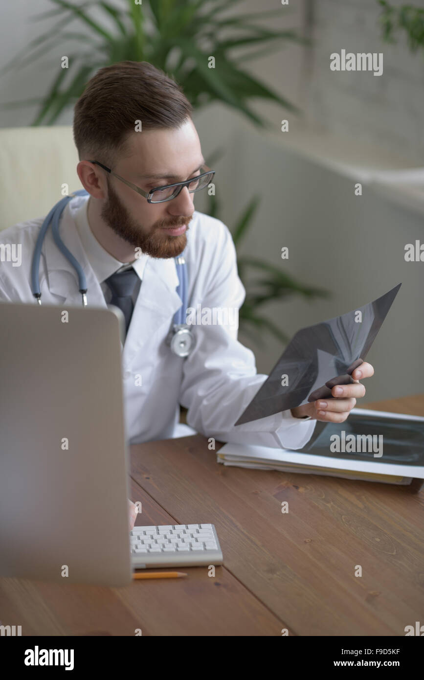 Doctor examining an elbow x-ray. Medicine and healthcare Stock Photo