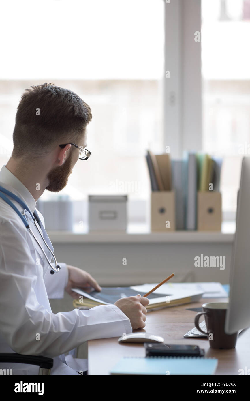 Doctor examining an elbow x-ray. Medicine and healthcare Stock Photo