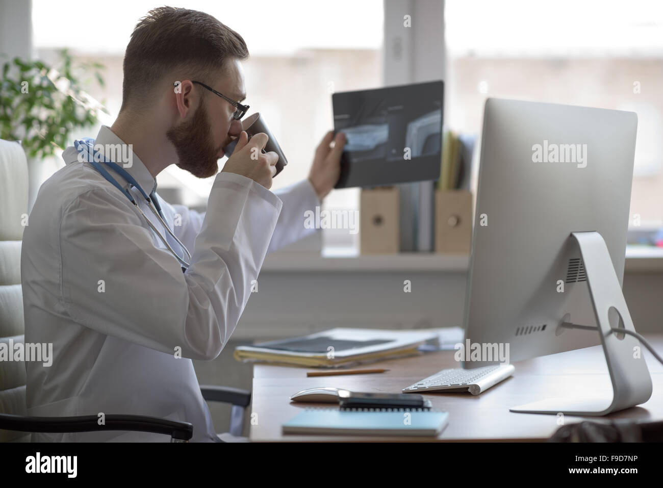 Doctor examining an elbow x-ray. Medicine and healthcare Stock Photo