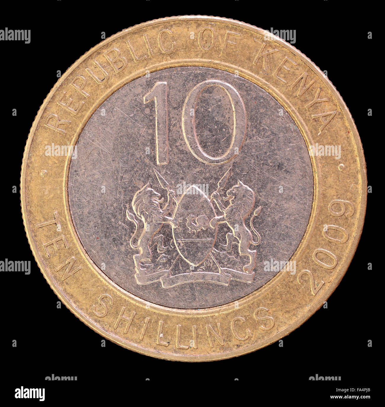 The tail face of ten shillings coin, issued by Kenya in 2009, depicting the lions and the shield, symbol of the country. Image i Stock Photo