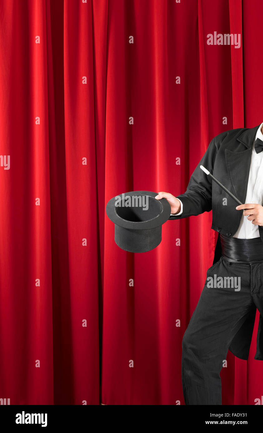 Magician Holding Magic Wand and Top Hat Stock Photo