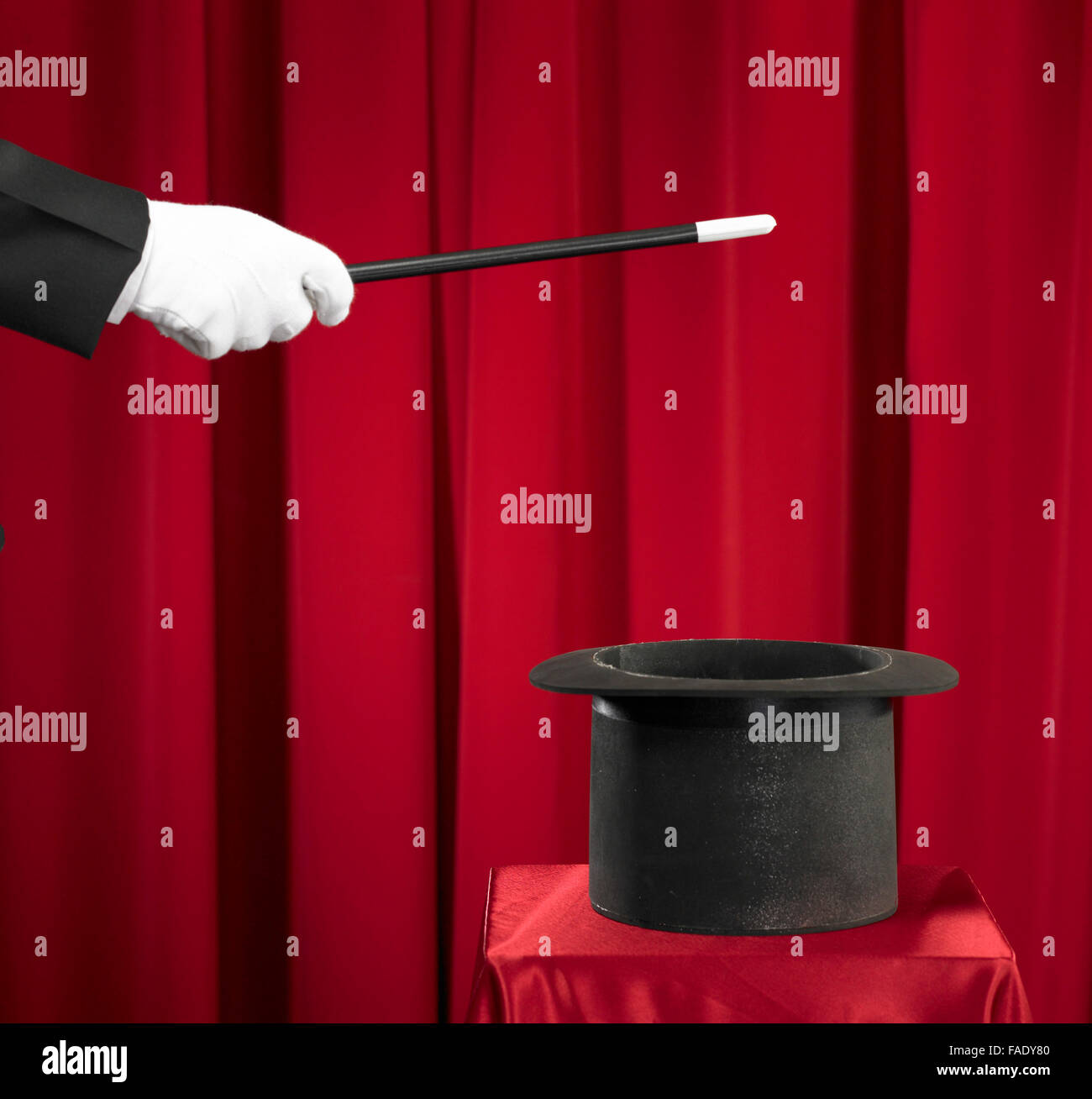 Magician Holding Magic Wand and Top Hat Stock Photo