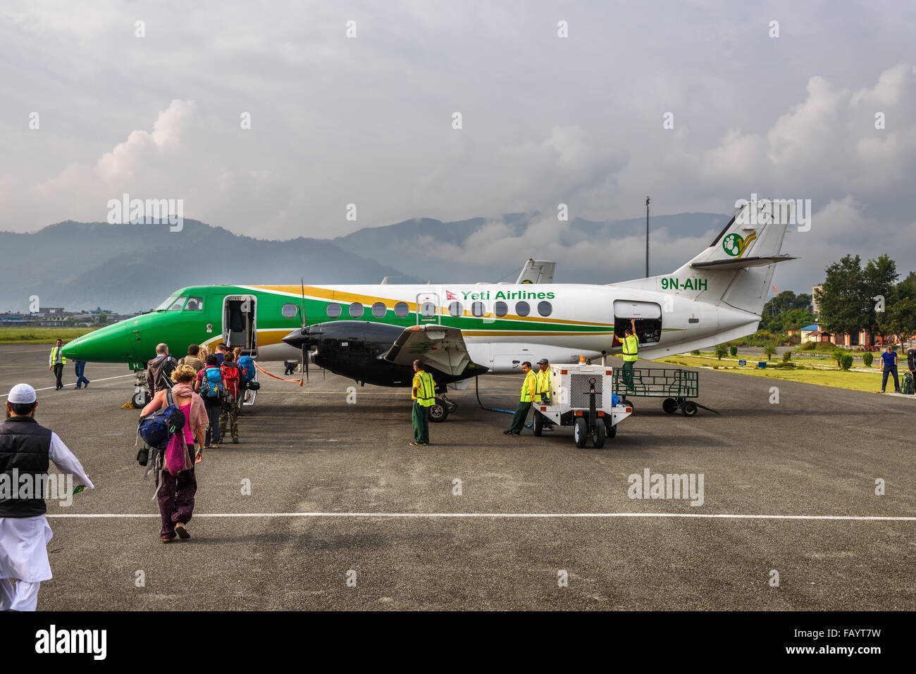 People board a small airplane flying from Pokhara to Kathmandu. Stock Photo