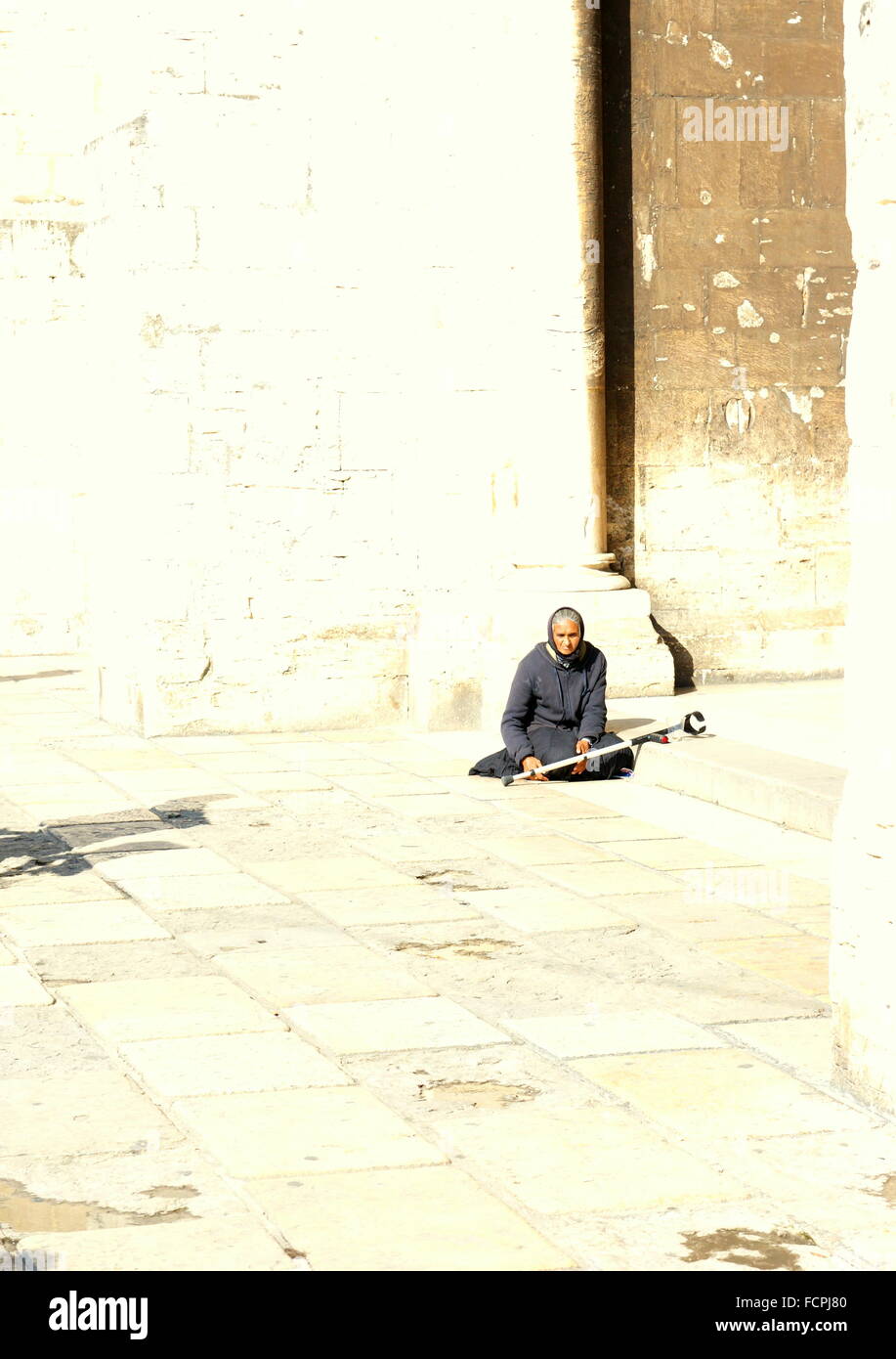 woman in black asking for money Stock Photo