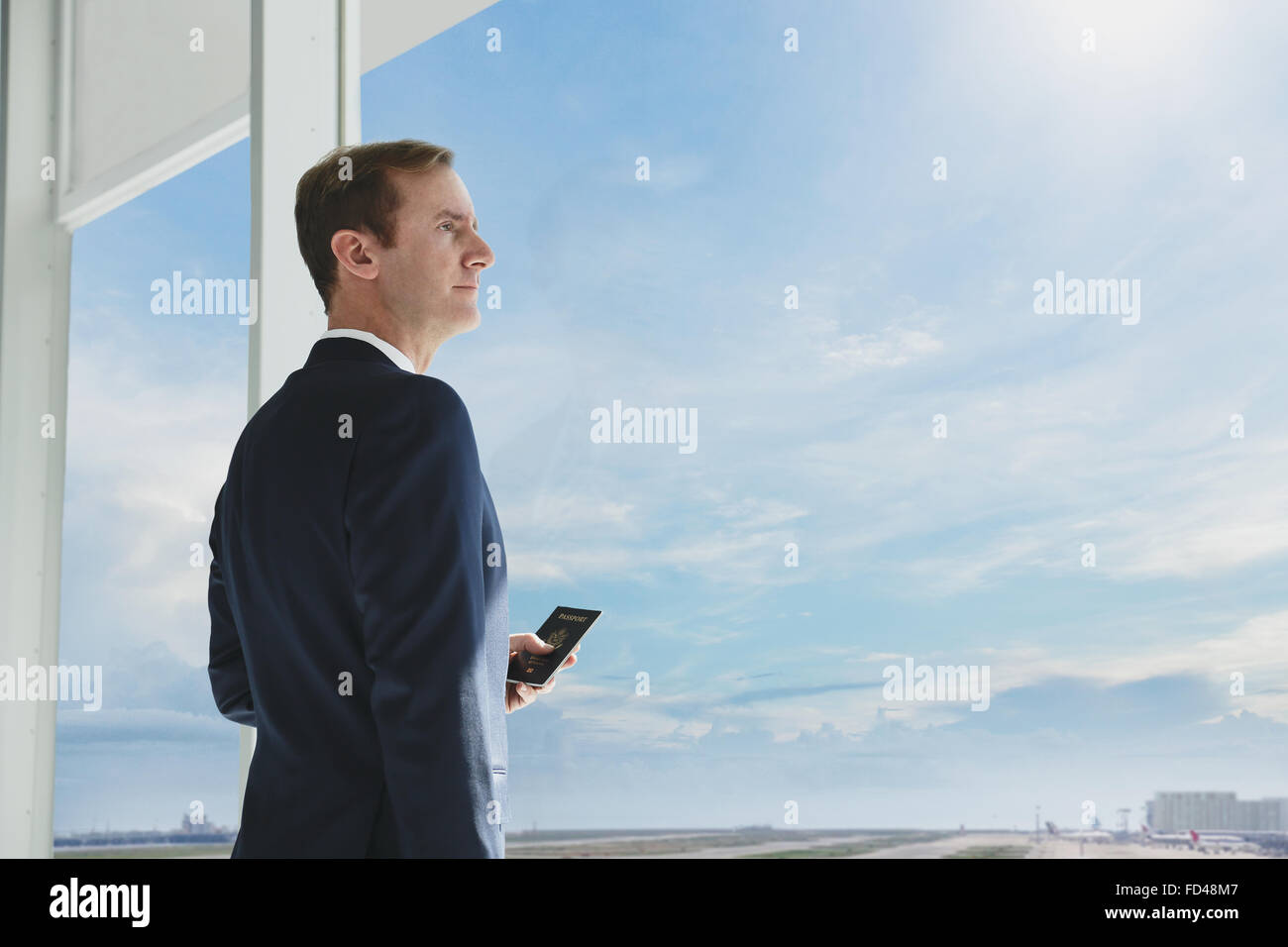 Caucasian businessman with phone in modern office Stock Photo