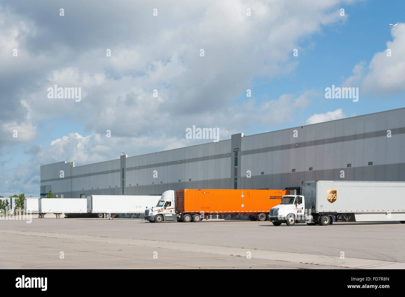 Logistics & warehouse loading bay with truck containers. Stock Photo