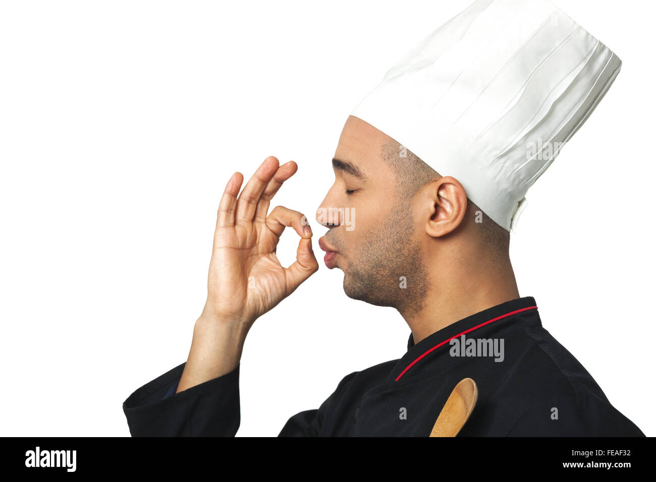 Profile portrait of happy Afro American professional cook isolated on white. Stock Photo