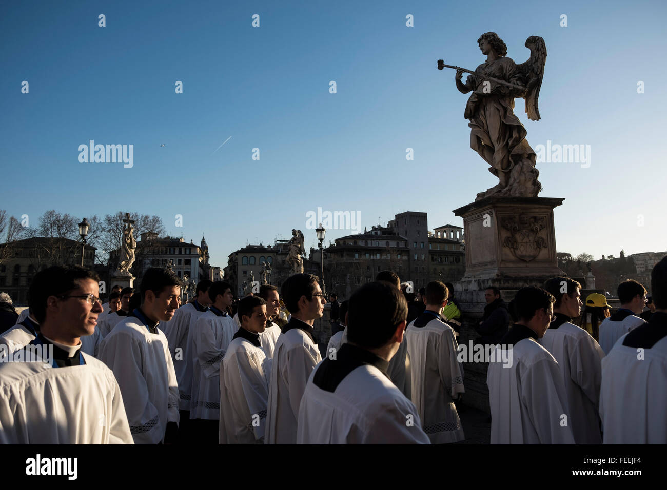 Rome, Italy. 05th Feb, 2016. Seminarians cross Ponte Sant'Angelo during a procession to honor the exhumed body of mystic saint Padre Pio. The body of one of the most popular Roman Catholic saints, Padre Pio began an overland journey in a crystal coffin to be display today in St. Peter's Basilica at the Vatican. Credit:  Christian Minelli/Pacific Press/Alamy Live News Stock Photo