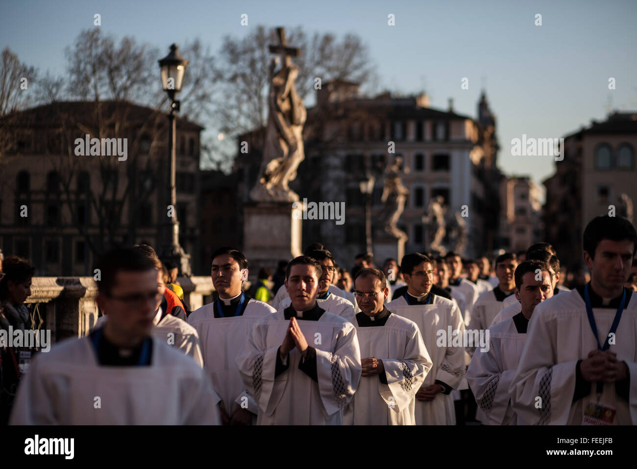 Rome, Italy. 05th Feb, 2016. Seminarians cross Ponte Sant'Angelo during a procession to honor the exhumed body of mystic saint Padre Pio. The body of one of the most popular Roman Catholic saints, Padre Pio began an overland journey in a crystal coffin to be display today in St. Peter's Basilica at the Vatican. Credit:  Christian Minelli/Pacific Press/Alamy Live News Stock Photo