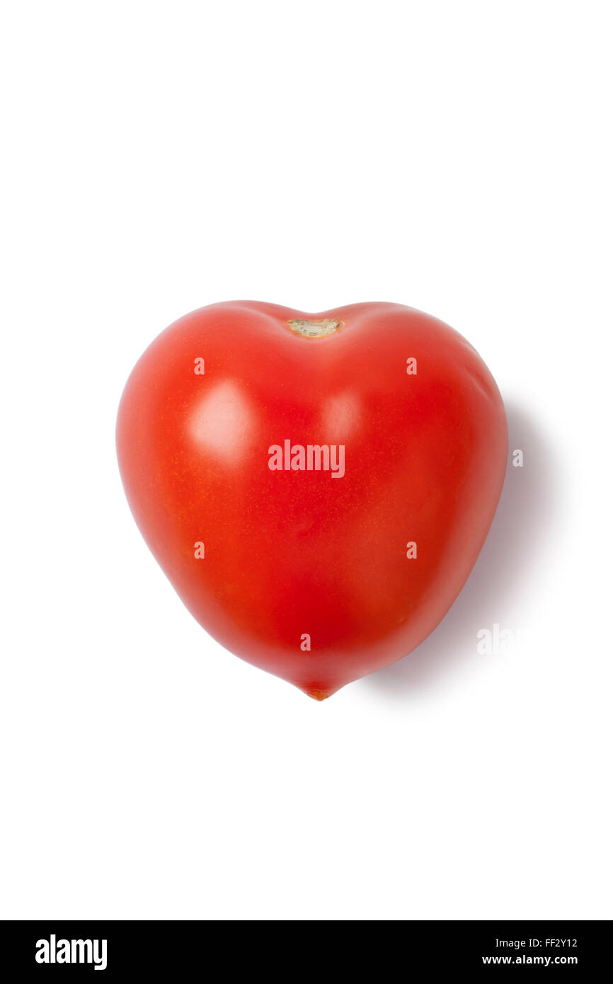 Fresh heart shaped tomato on white background Stock Photo