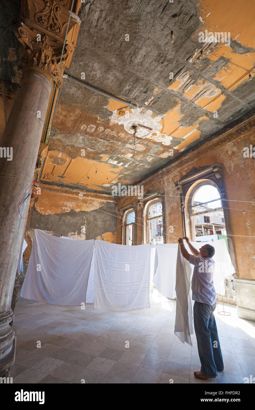 Hanging out the laundry sheets inside building at Havana, Cuba, West Indies, Caribbean, Central America Stock Photo