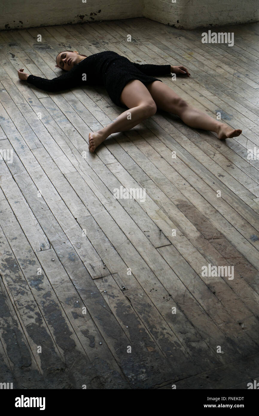 Dead woman's body on the floor Stock Photo