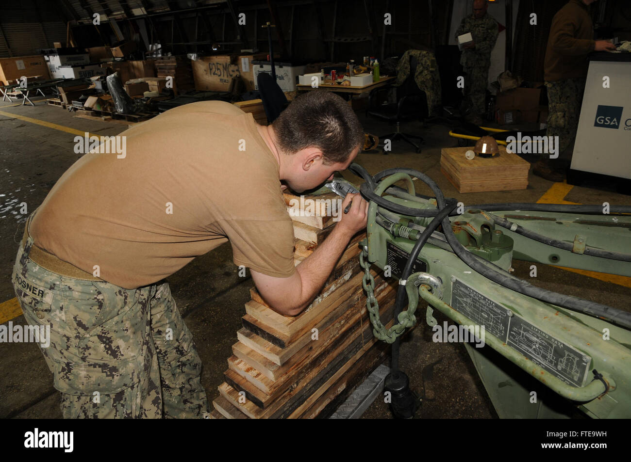 140213-N-YB423-018 ROTA, Spain (Feb. 13, 2014) - Builder Constructionman Tyler Rosner, assigned to Naval Mobile Construction Battalion (NMCB) 74, labels a piece of Civil Engineer Support Equipment (CESE) as part of an embarkation exercise on Camp Mitchell. (U.S. Navy photo by Mass Communication Specialist Ryan Williams)  Join the conversation on Twitter ( https://twitter.com/naveur navaf )  follow us on Facebook ( https://www.facebook.com/USNavalForcesEuropeAfrica )  and while you're at it check us out on Google+ ( https://plus.google.com/101085806745039159791/posts#101085806745039159791/posts Stock Photo