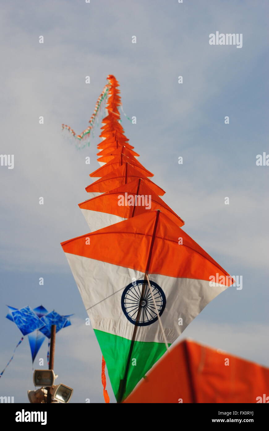 a bright and colourful Indian flag shaped kite flying during the Kite Flying festival in New Delhi, India Stock Photo