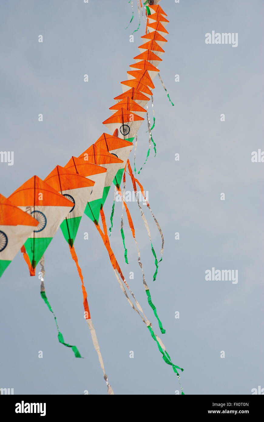 a bright and colourful Indian flag shaped kite flying during the Kite Flying festival in New Delhi, India Stock Photo