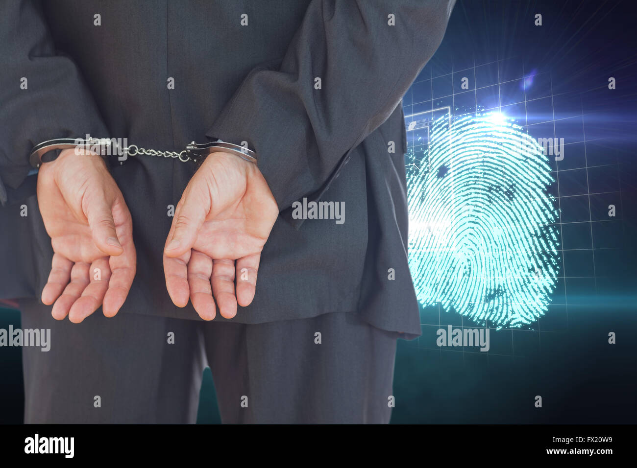 Composite image of businessman in handcuffs Stock Photo