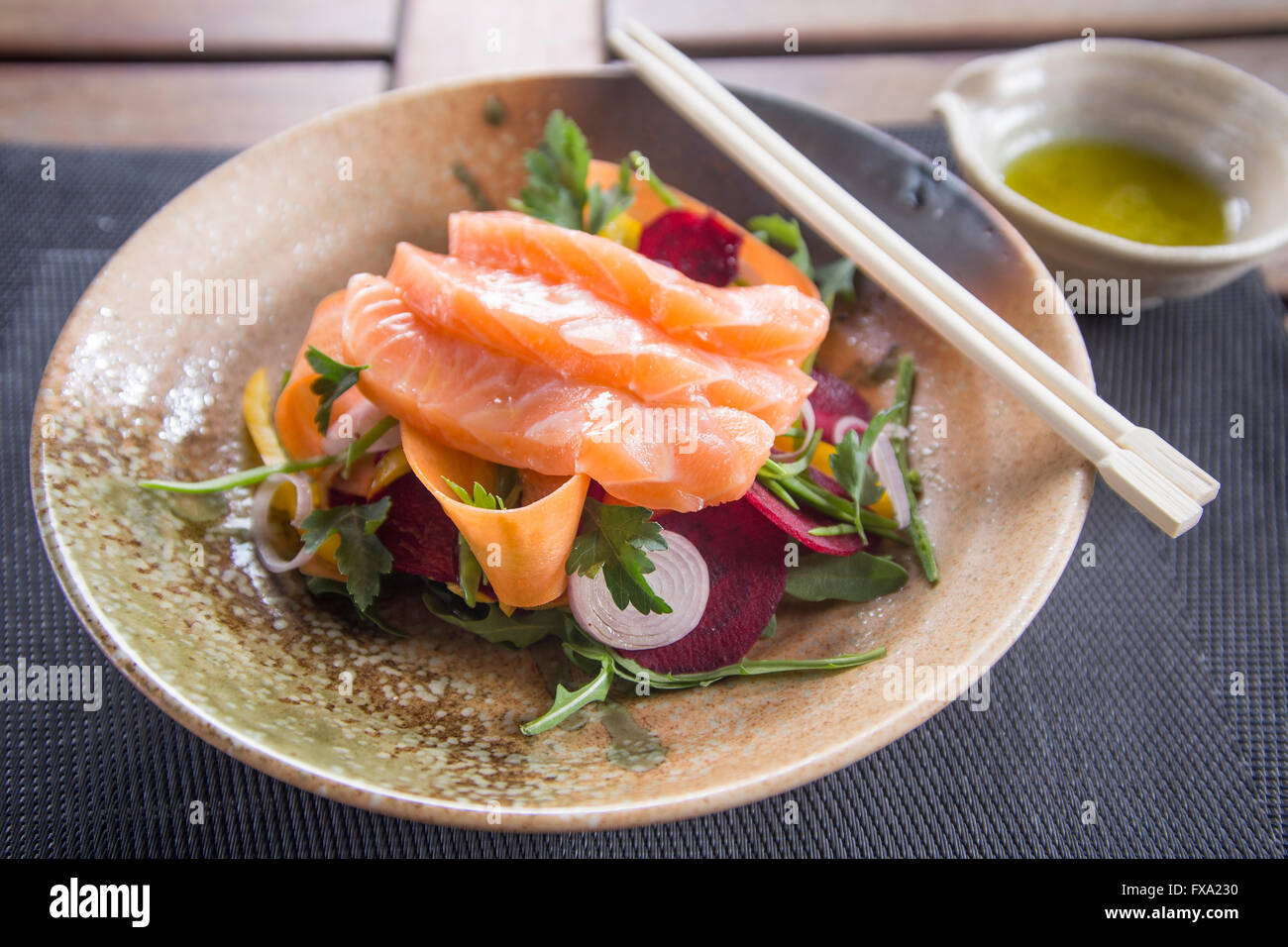 Salmon Sashimi with rainbow salad Stock Photo