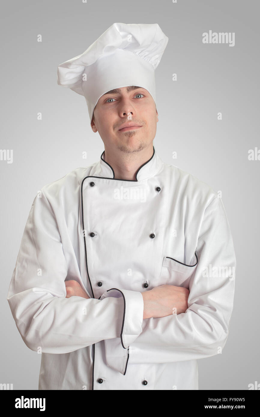 young cook man standing on a white background Stock Photo