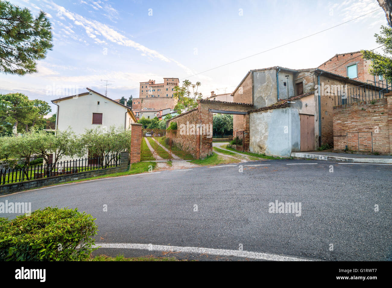 castle overlooking the streets of a small hilltop village in Emilia Romagna in Italy Stock Photo