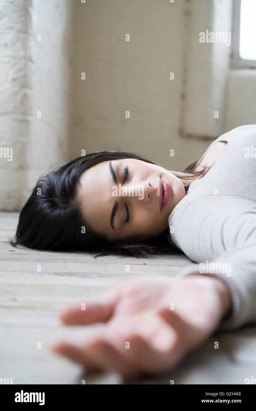 Dead woman on the floor Stock Photo