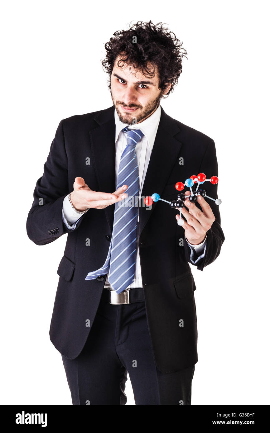 a businessman wearing a suit and a tie holding a trinitrotoluene tnt molecular model isolated over white Stock Photo