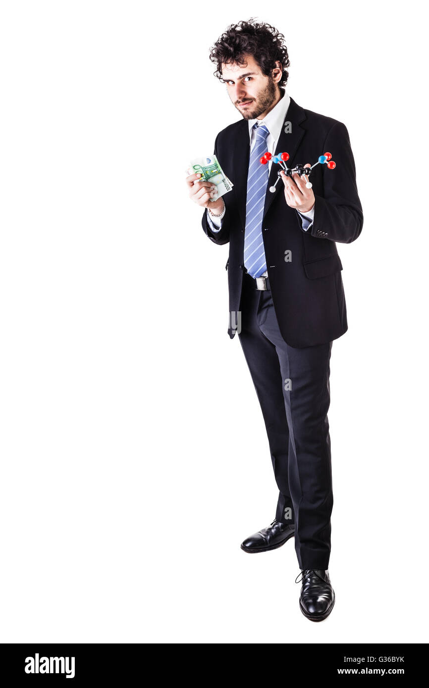 a businessman wearing a suit and a tie holding a trinitrotoluene tnt molecular model and money bills isolated over white Stock Photo