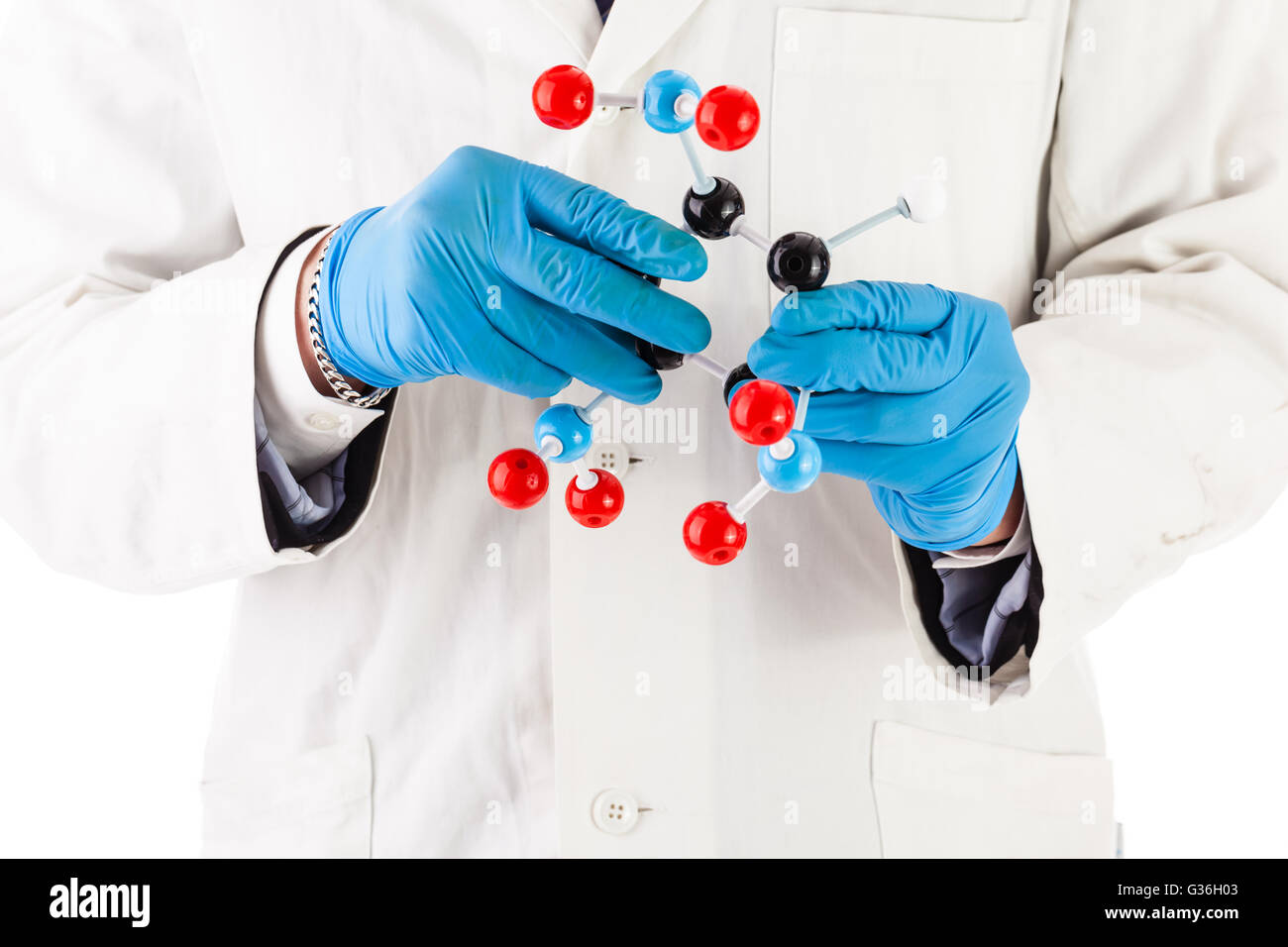 a doctor or researcher with a white lab coat holding a trinitrotoluene tnt molecular model Stock Photo