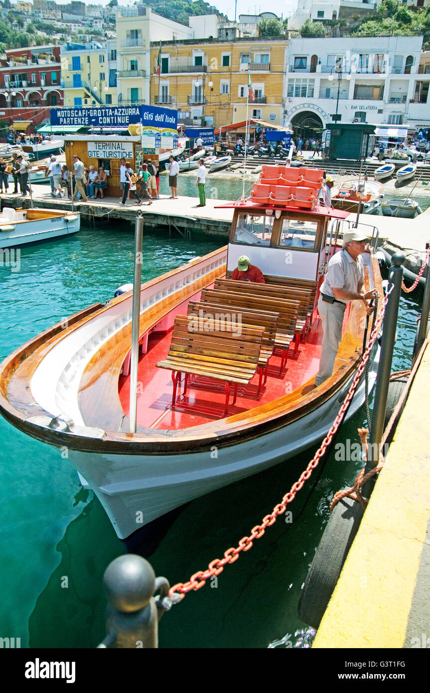 An old-fashioned boat for taking tourists to the blue grotto in the harbour on the Isle of Capri in the Bay of Naples, Italy Stock Photo