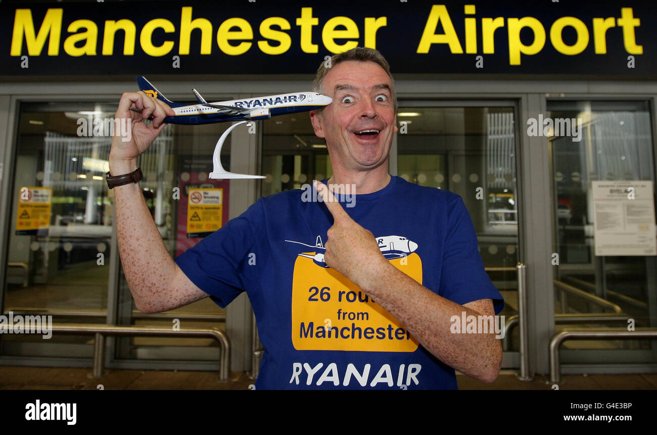 Ryanair Chief Executive Michael O'Leary poses for a photograph outside Terminal 2 arrivals at Manchester Airport. Stock Photo