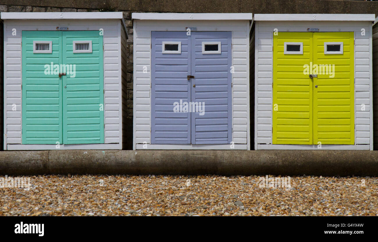 Coloured beach huts on Lyme Regis beach Stock Photo