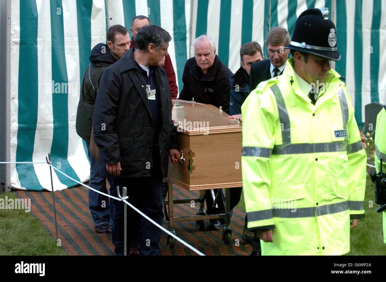 Rachel Whitear's coffin is led to a hearse, after it was exhumed at the Church of St Peter in Withington, near Hereford. It was originally thought that Miss Whitear died from a drugs overdose at her bedsit in Exmouth, Devon, but no post-mortem examination was carried out prior to an inquest which recorded an open verdict. Stock Photo