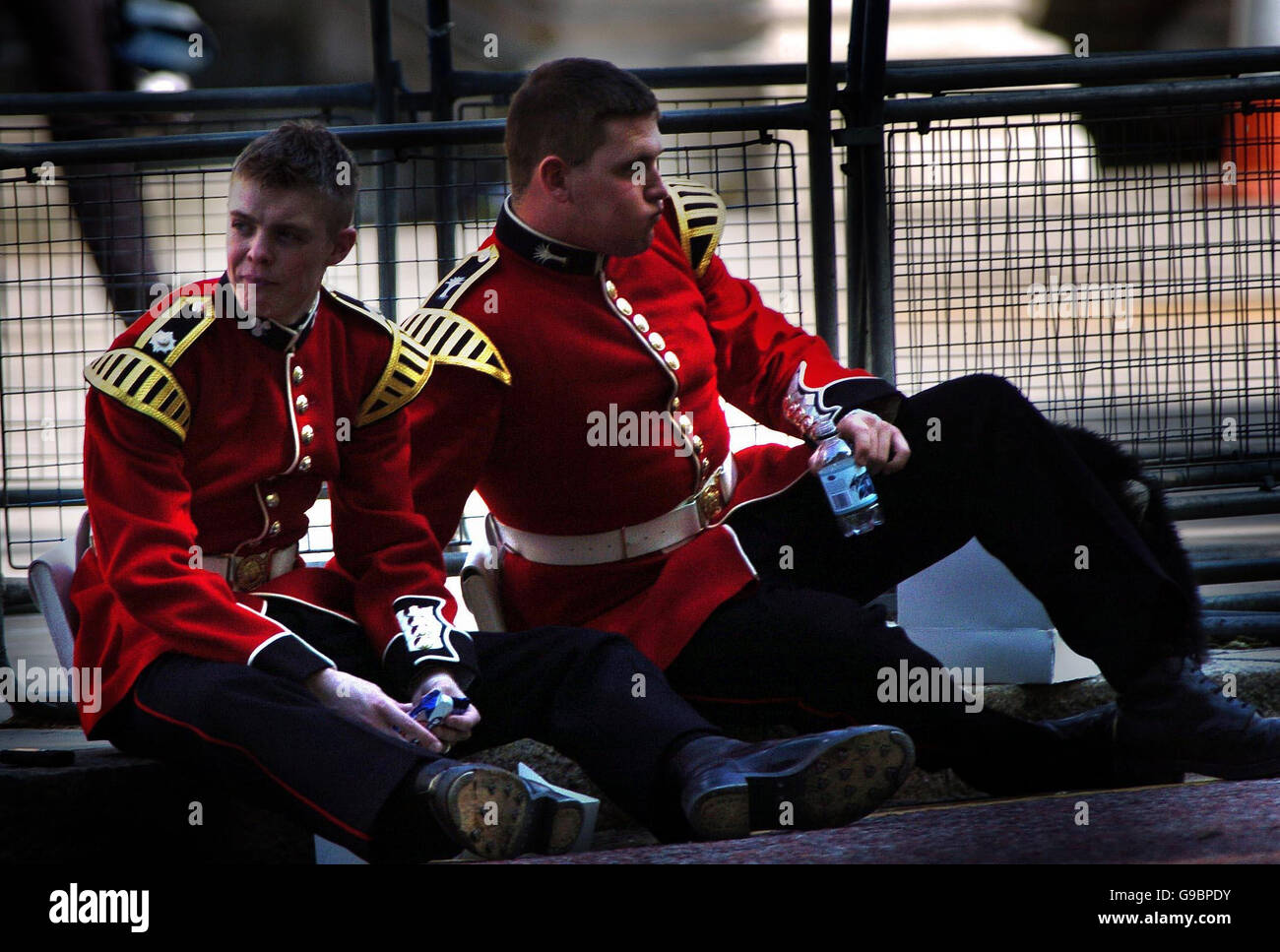 Guardsmen take a rest during rehearsals for tomorrow's Beating the Retreat ceremony on Horseguards Parade. Stock Photo