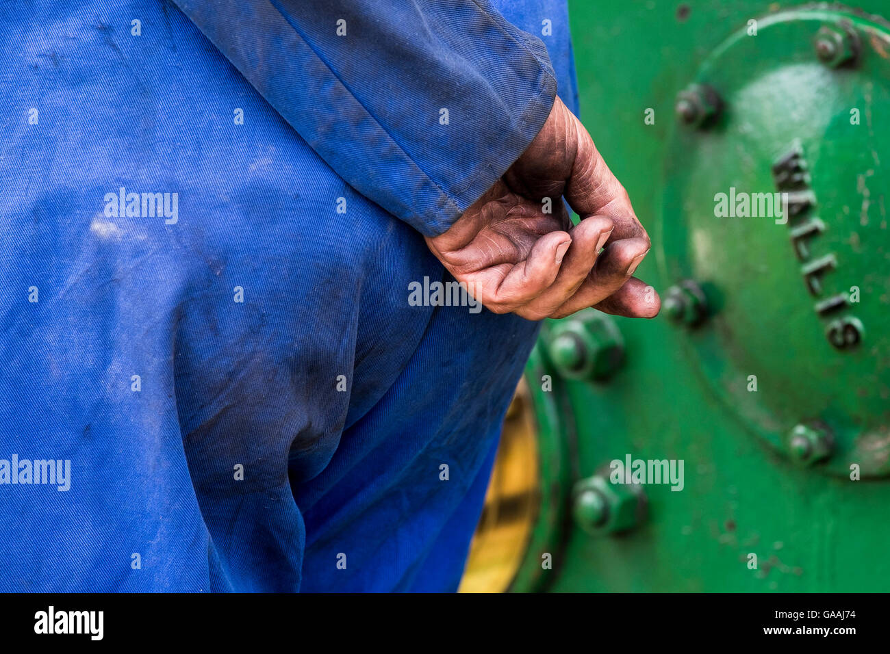 The oil covered hand of a manual worker. Stock Photo