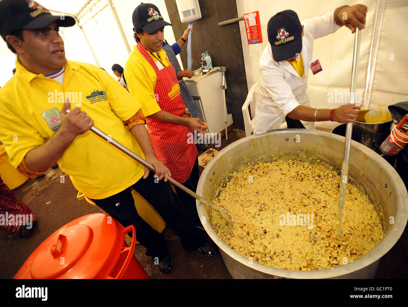 Volunteers stir food at the Shree Krishna Janmashtami festival at Bhaktivedanta Manor in Watford. Stock Photo