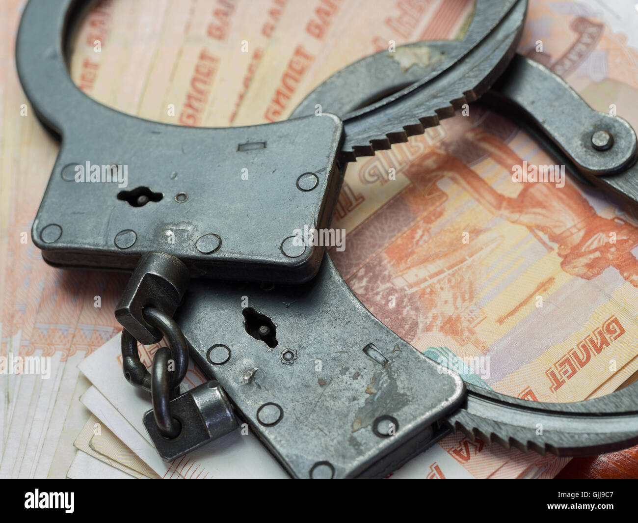 Handcuffs,and money.The concept of crime and punishment. Stock Photo