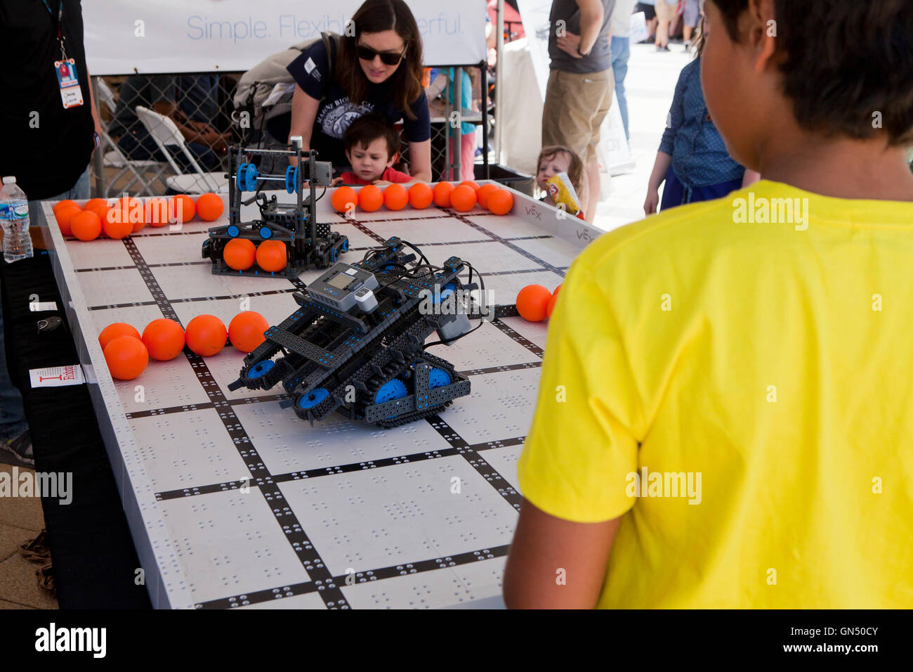 Schoolchild controlling a robot at Maker Faire - Washington, DC USA Stock Photo